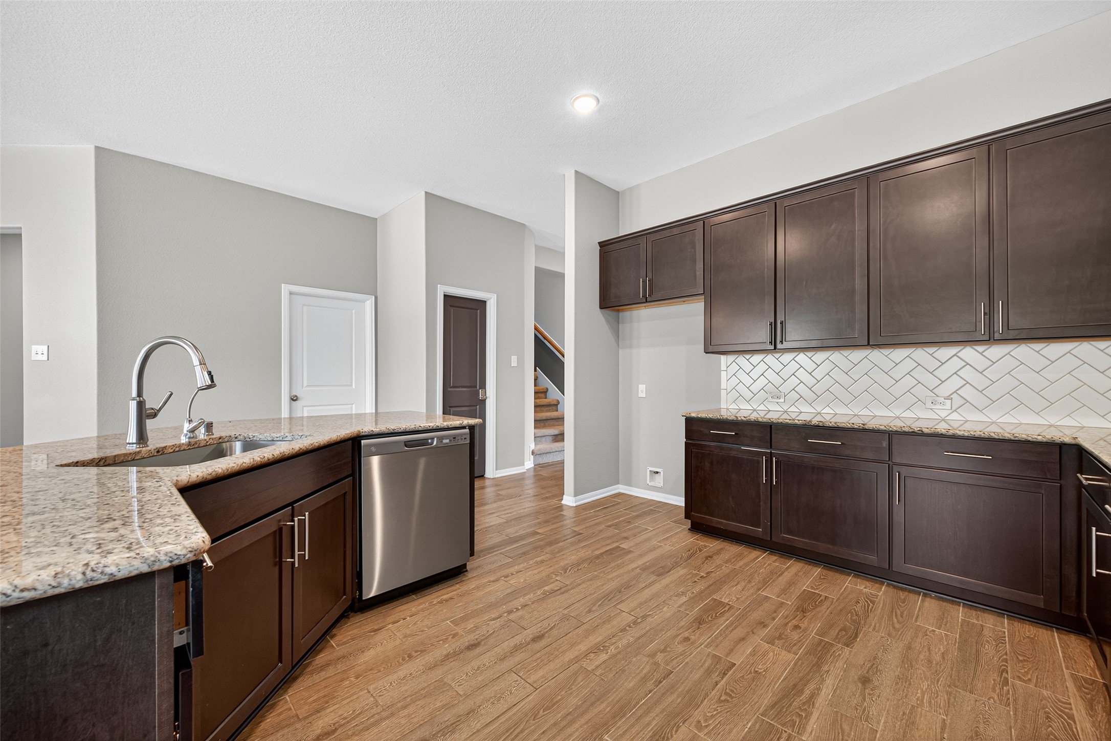 1312 Mainland Shores Lane Montgomery, TX 77316 - Photo 21 of 50 a kitchen with stainless steel appliances granite countertop a sink a stove and cabinets