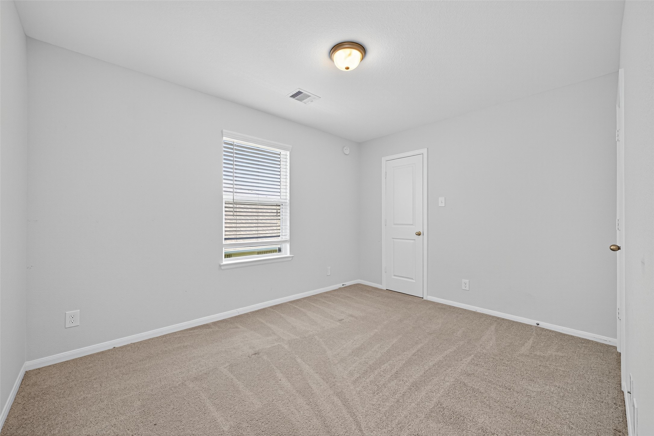 1312 Mainland Shores Lane Montgomery, TX 77316 - Photo 30 of 50 a view of an empty room with a window