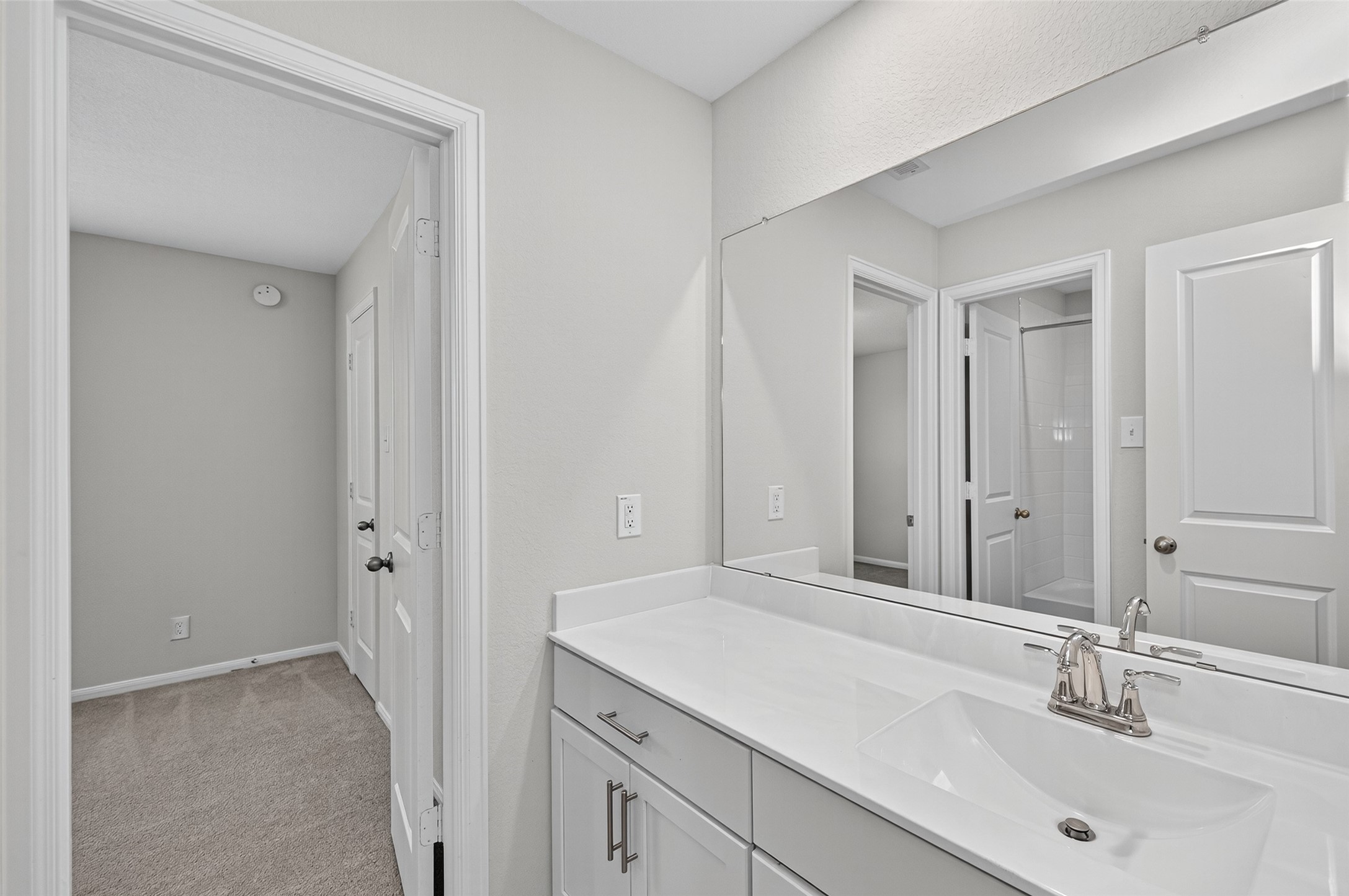 1312 Mainland Shores Lane Montgomery, TX 77316 - Photo 34 of 50 a bathroom with a sink and a mirror