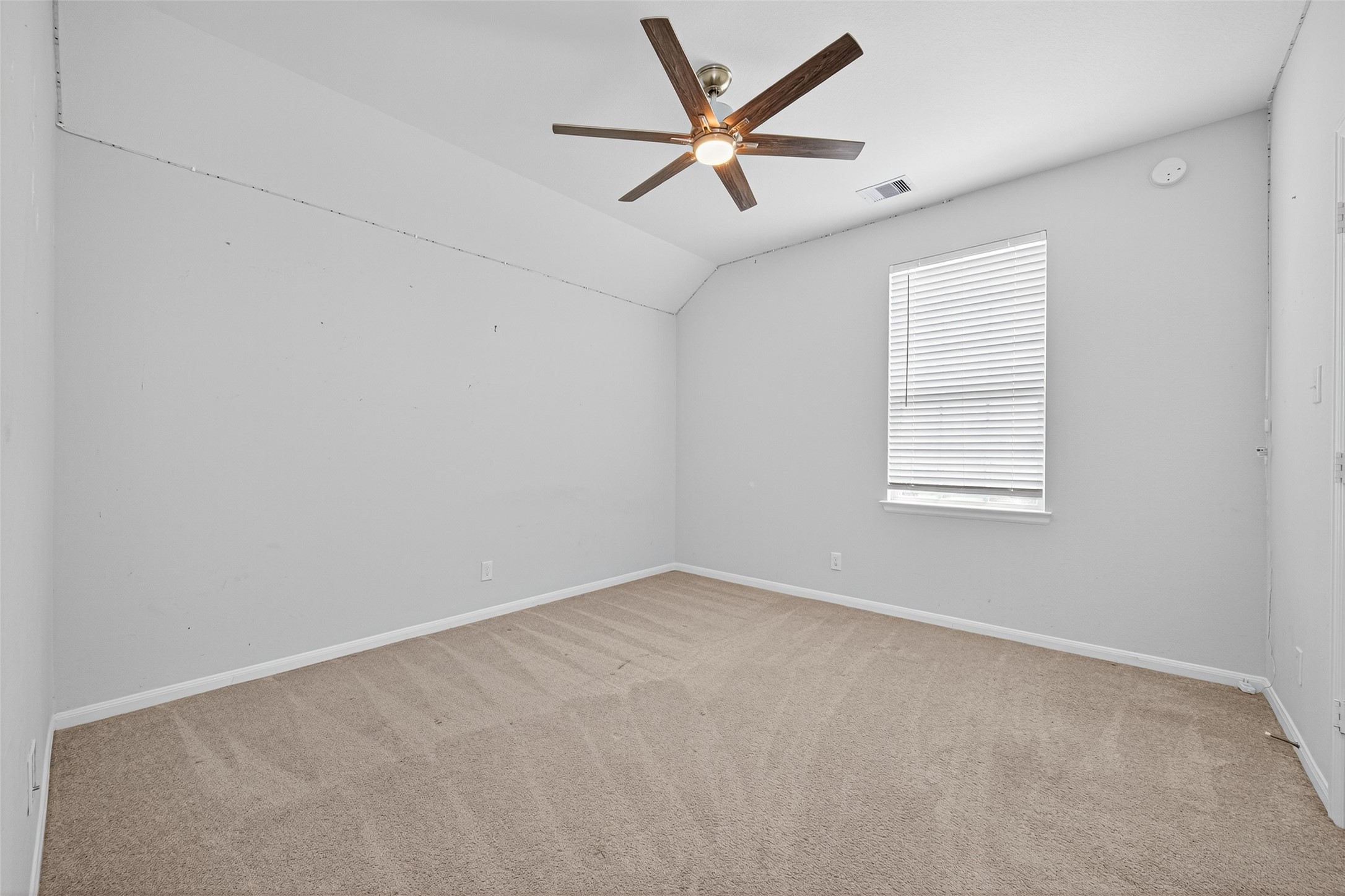 1312 Mainland Shores Lane Montgomery, TX 77316 - Photo 35 of 50 an empty room with a window and a fan