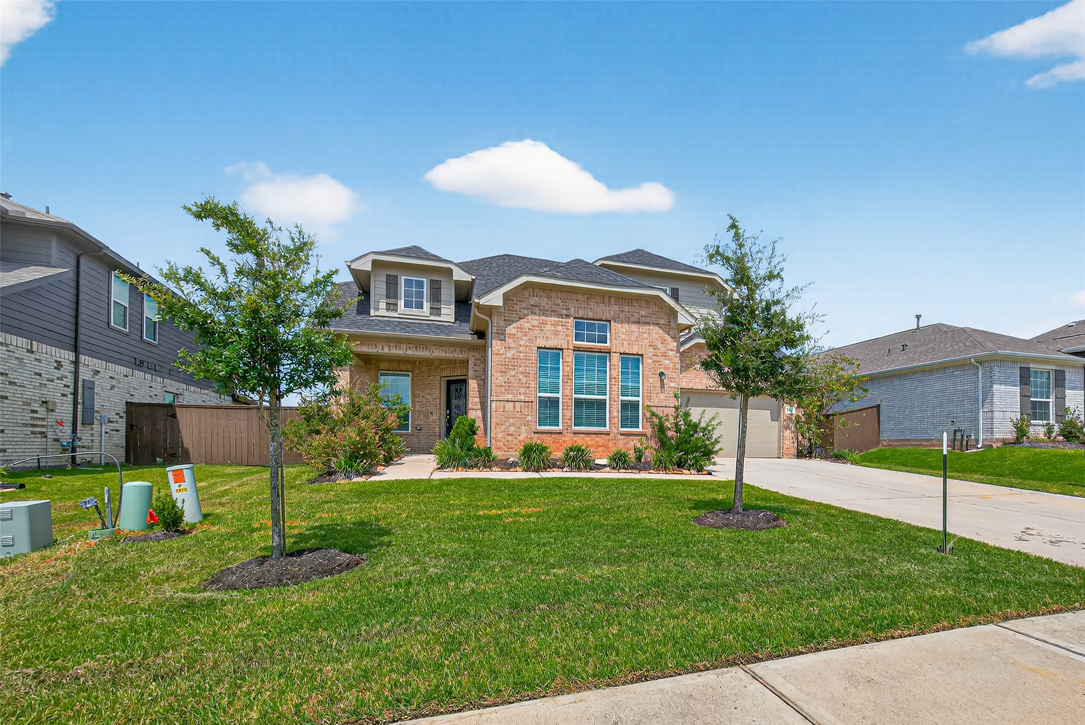 1312 Mainland Shores Lane Montgomery, TX 77316 - Photo 4 of 50 a front view of a house with a yard