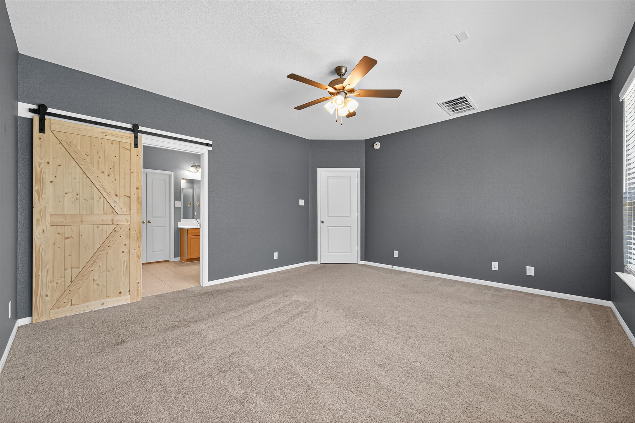 1312 Mainland Shores Lane Montgomery, TX 77316 - Photo 41 of 50 a view of an empty room with a ceiling fan