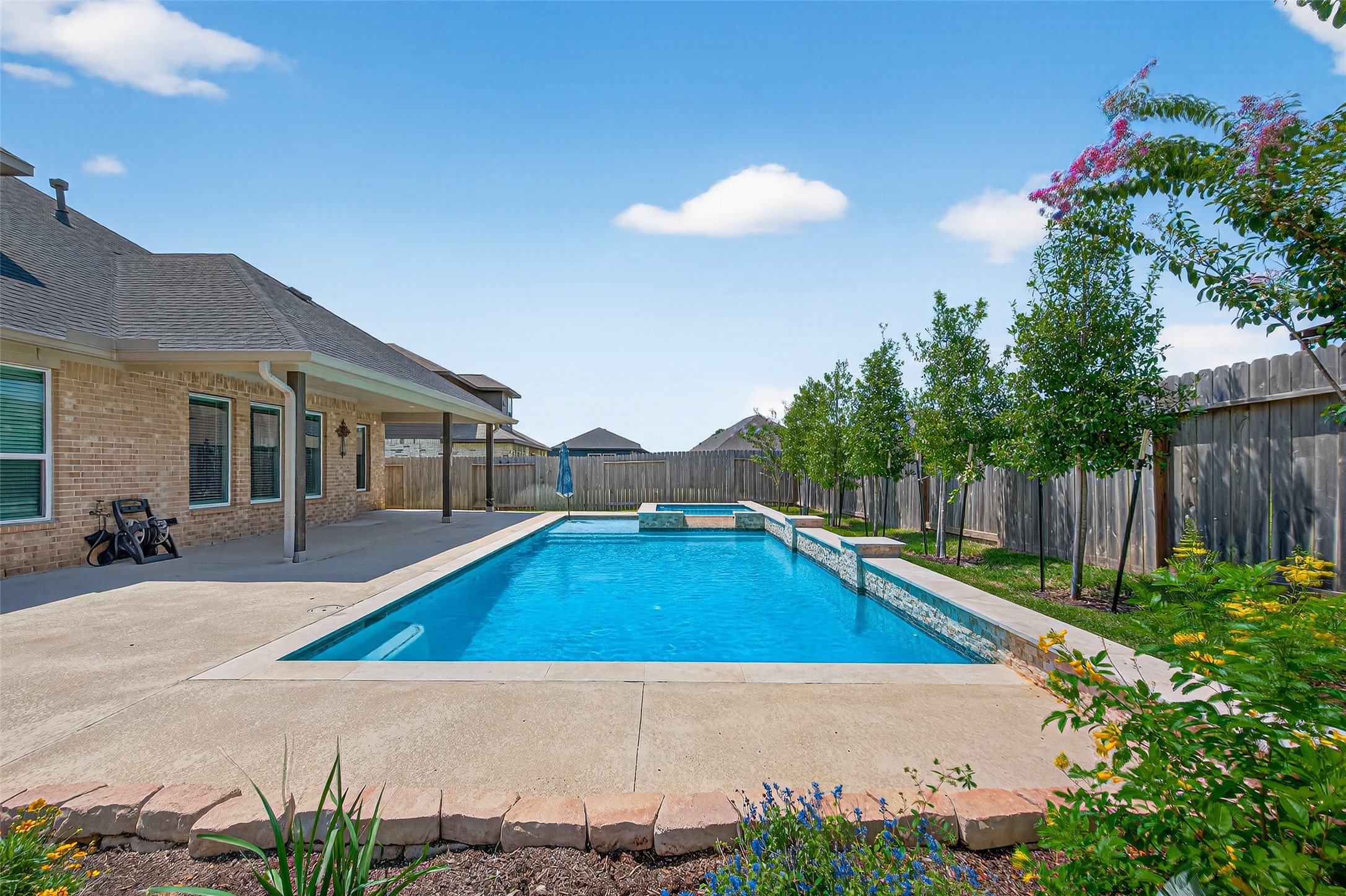 1312 Mainland Shores Lane Montgomery, TX 77316 - Photo 50 of 50 a view of an house with backyard space and swimming pool