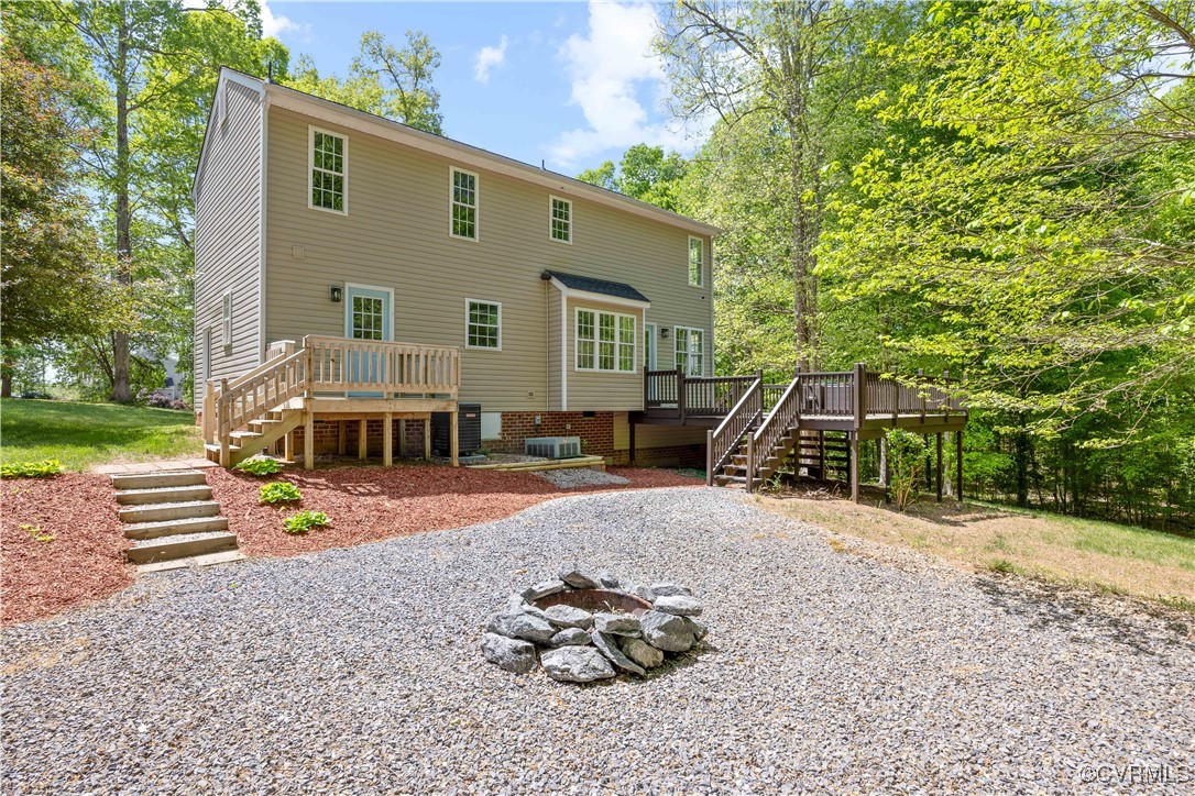 11730 Corte Castle Road Chesterfield, VA 23838 - Photo 35 of 50 Back of property with central AC unit, a fire pit,