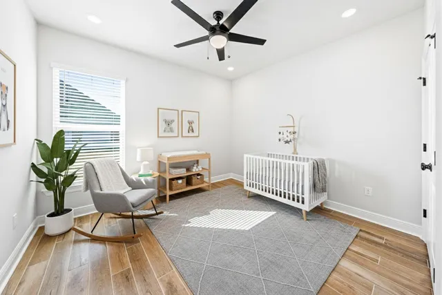 a bedroom with furniture and a window