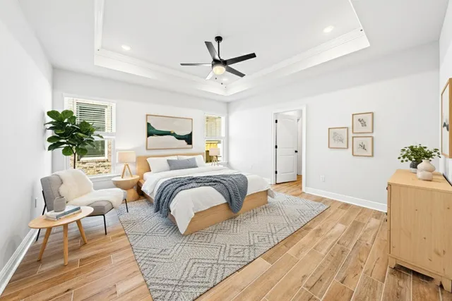 a bedroom with a large bed and a couch