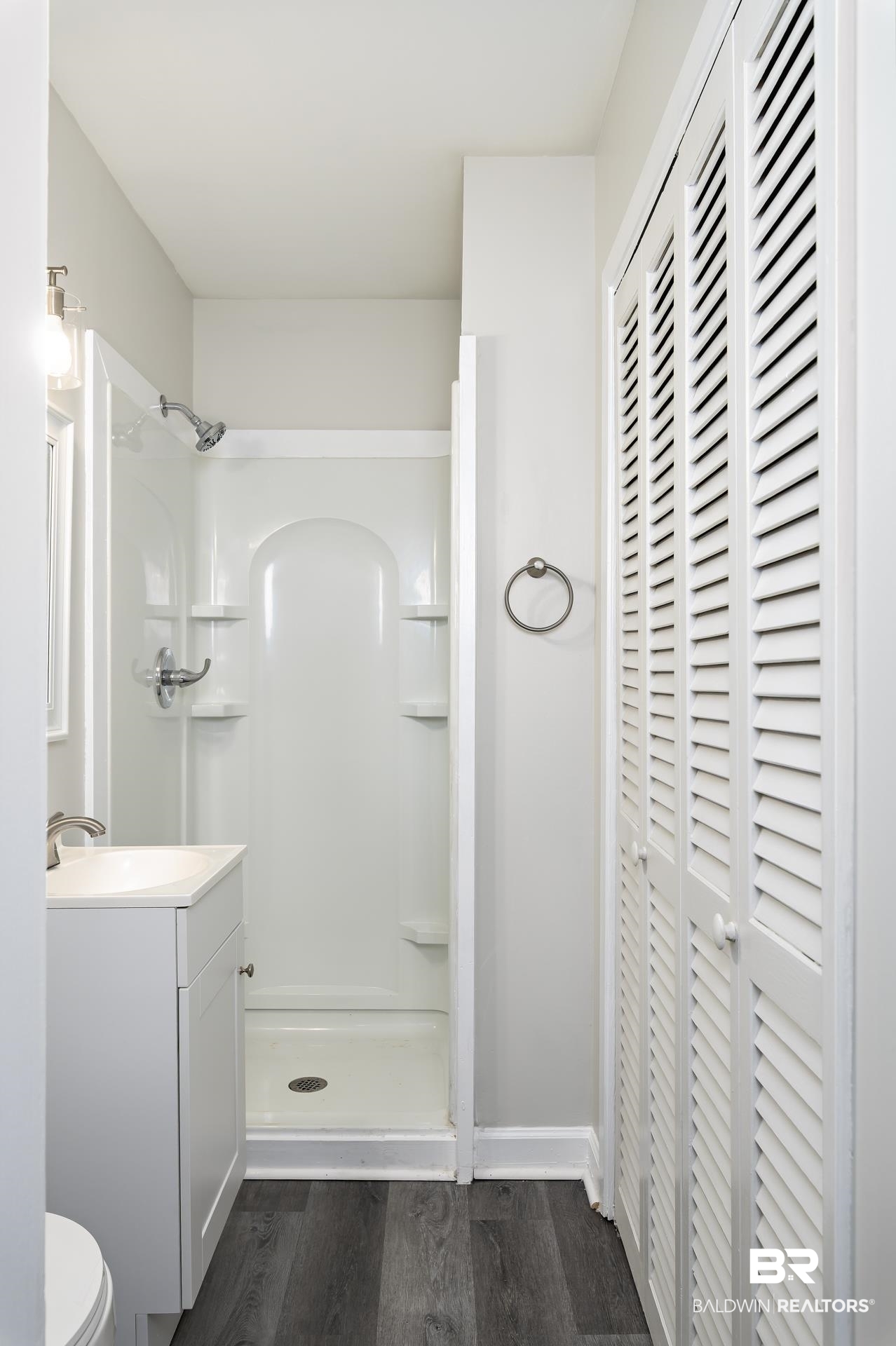 5922 Sunnyside Drive Mobile, AL 36619 - Photo 23 of 51 Bathroom with wood finished floors, a stall shower, vanity, and toilet