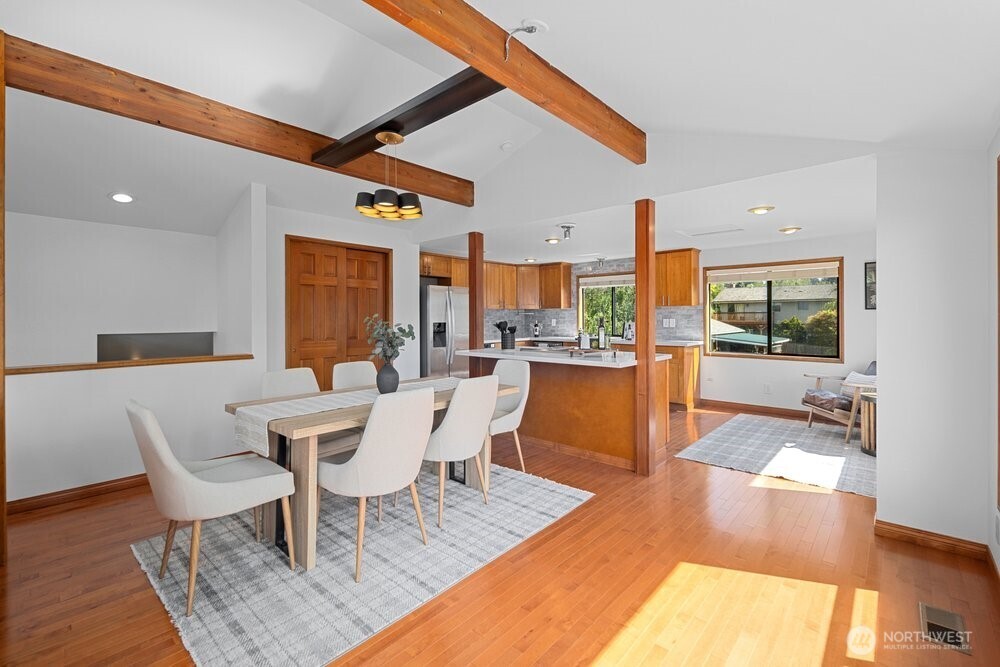 902 7th Avenue South Edmonds, WA 98020 - Photo 9 of 31 a dining room with a table chairs and a dining table