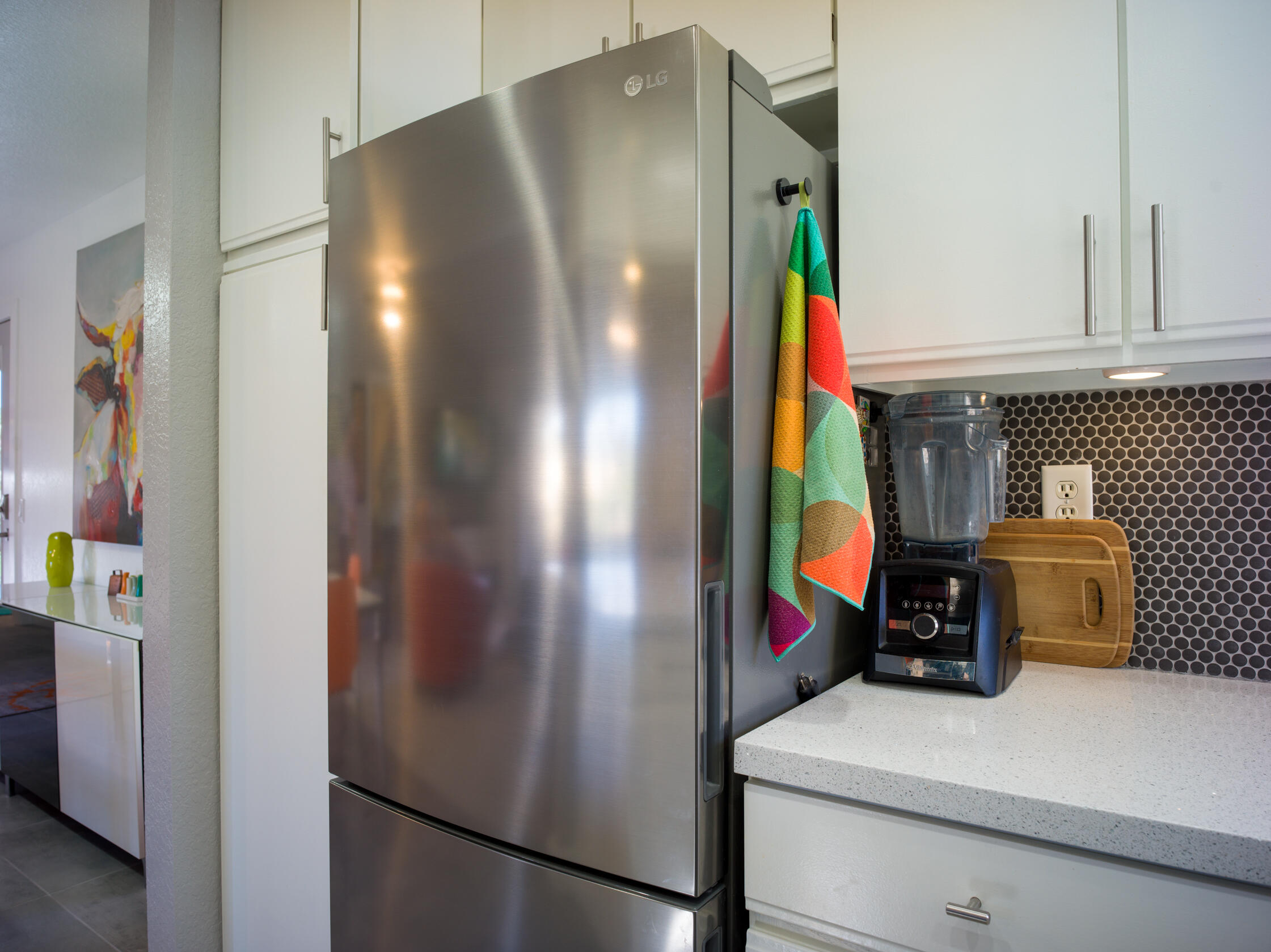 2700 Lawrence Crossley Road, Unit 7 Palm Springs, CA 92264 - Photo 12 of 28 a kitchen with stainless steel appliances granite countertop a refrigerator and a stove