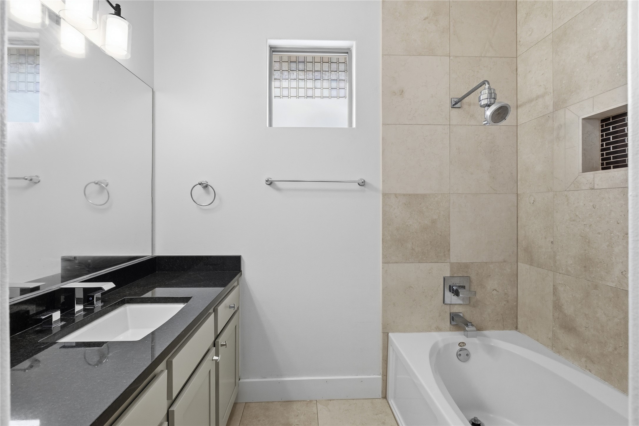 4124 Valley View Road, Unit 4A & 4B Austin, TX 78704 - Photo 34 of 40 A well-appointed bathroom features a single vanity, a spacious bathtub, and practical tile flooring.