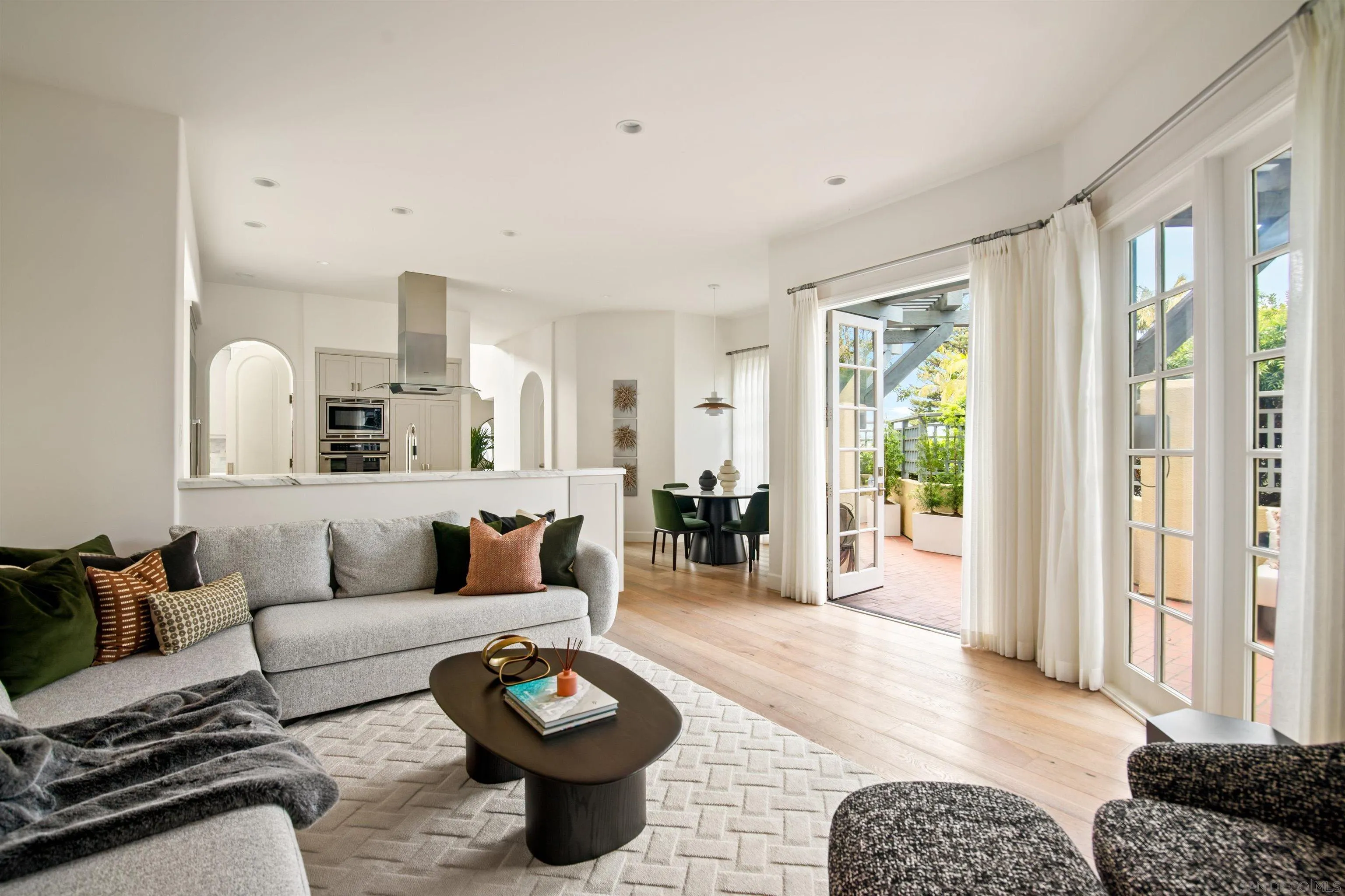 7729 Ivanhoe Avenue La Jolla, CA 92037 - Photo 11 of 28 a living room with furniture fireplace and a window