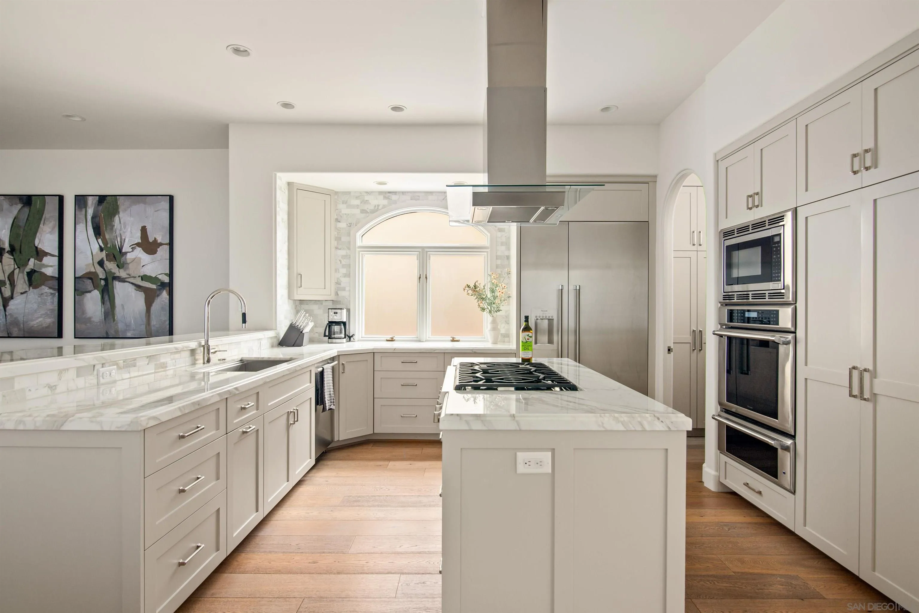 7729 Ivanhoe Avenue La Jolla, CA 92037 - Photo 13 of 28 a kitchen with a sink stove and refrigerator
