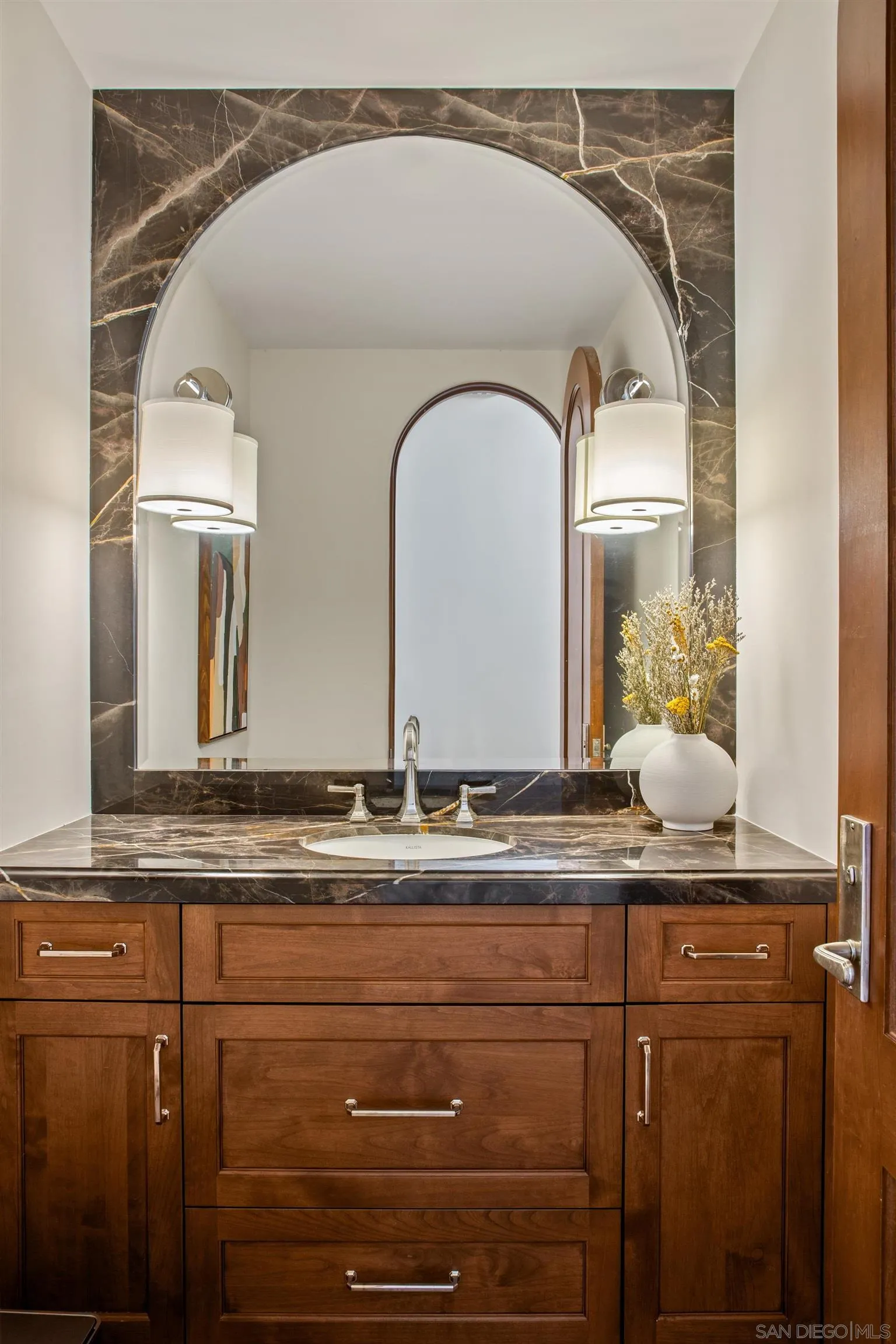7729 Ivanhoe Avenue La Jolla, CA 92037 - Photo 15 of 28 a bathroom with a granite countertop sink a mirror and