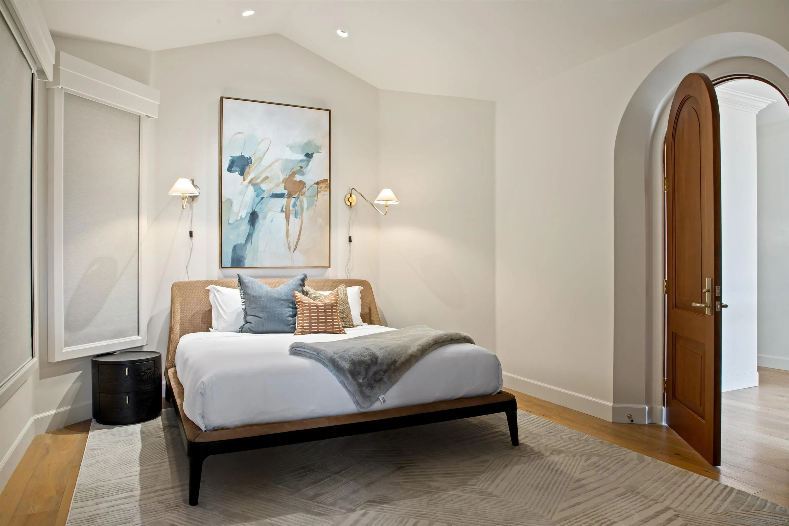 7729 Ivanhoe Avenue La Jolla, CA 92037 - Photo 17 of 28 a bedroom with a bed and a painting on the wall