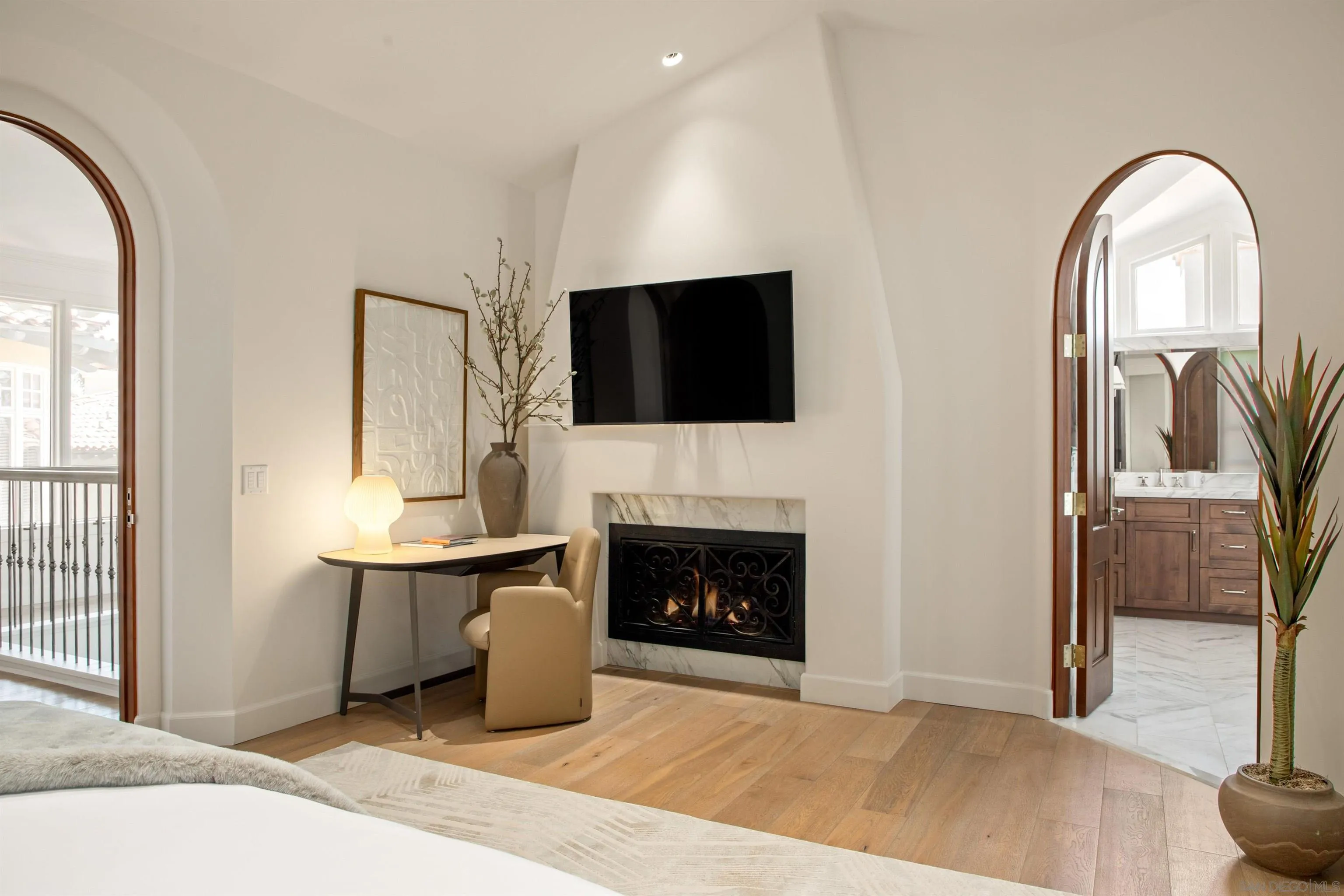 7729 Ivanhoe Avenue La Jolla, CA 92037 - Photo 18 of 28 a living room with furniture a fireplace and a flat screen tv