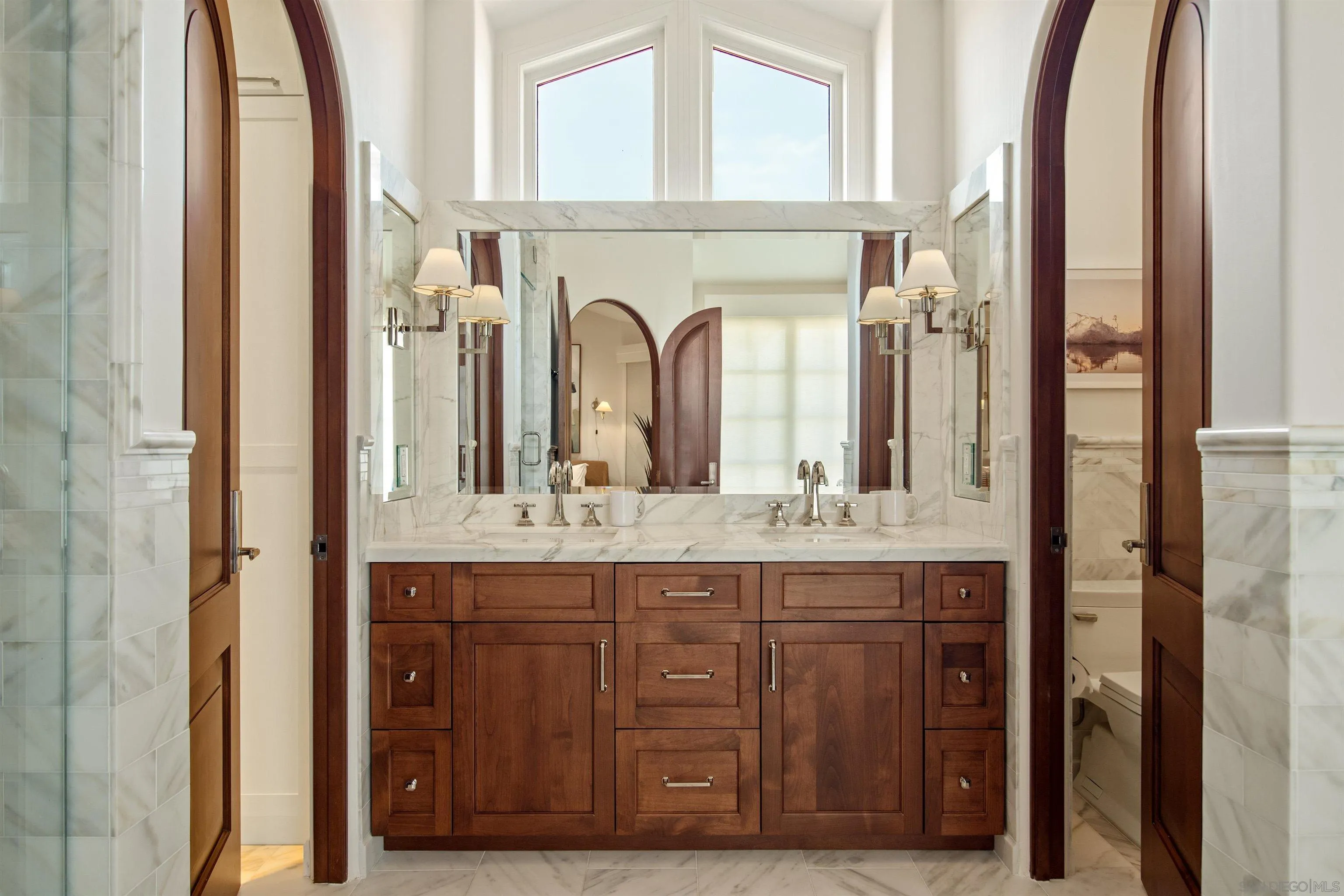 7729 Ivanhoe Avenue La Jolla, CA 92037 - Photo 21 of 28 a bathroom with a granite countertop sink and a mirror