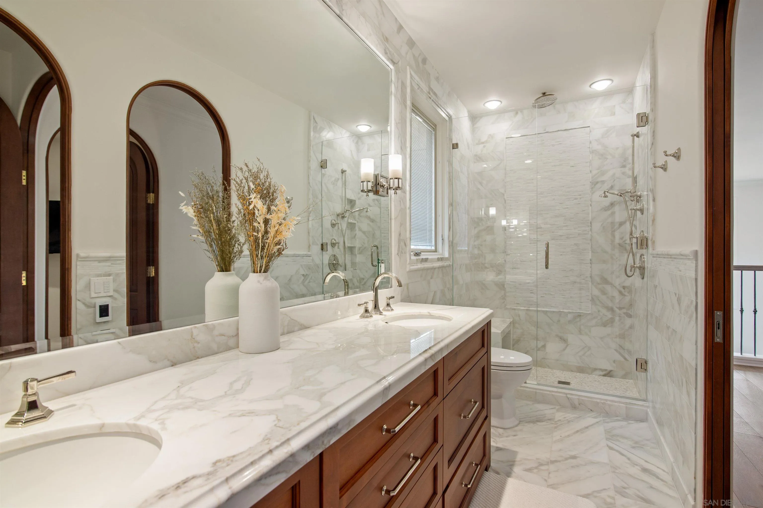 7729 Ivanhoe Avenue La Jolla, CA 92037 - Photo 25 of 28 a bathroom with a double vanity sink mirror and shower