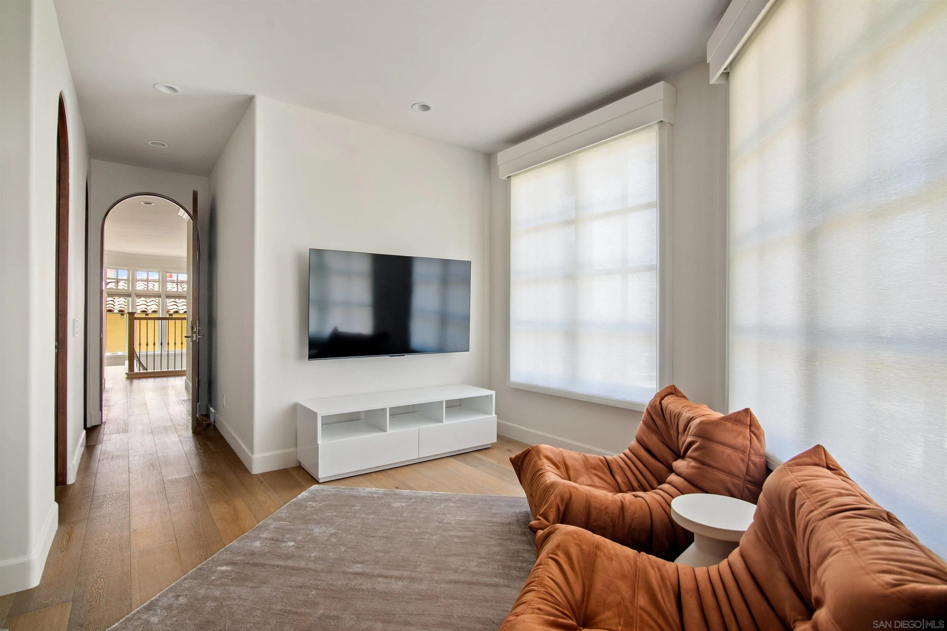 7729 Ivanhoe Avenue La Jolla, CA 92037 - Photo 27 of 28 a living room with furniture and a flat screen tv