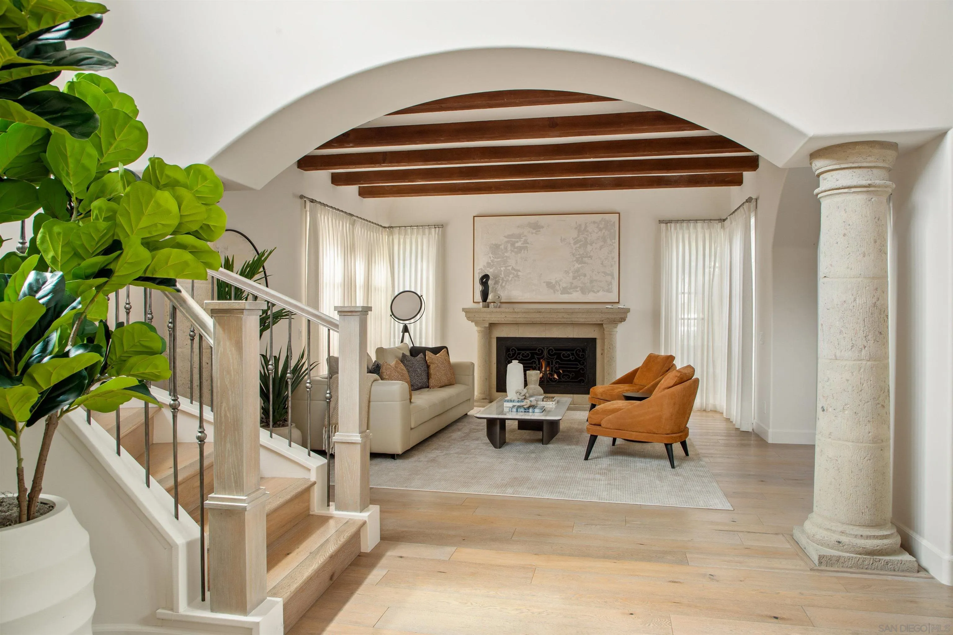 7729 Ivanhoe Avenue La Jolla, CA 92037 - Photo 6 of 28 a living room with furniture and a fireplace