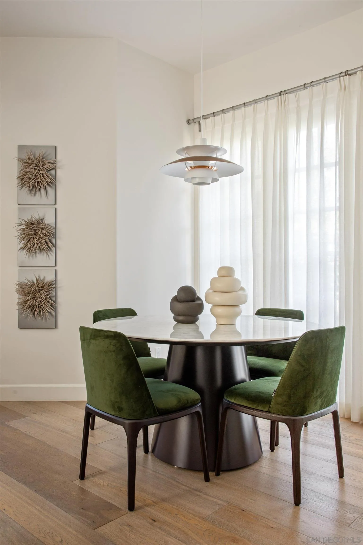 7729 Ivanhoe Avenue La Jolla, CA 92037 - Photo 8 of 28 a view of a dining room with furniture window and wooden floor