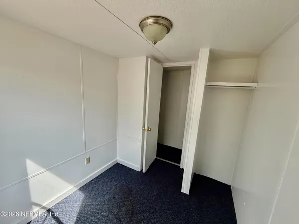 a view of room with hardwood floor