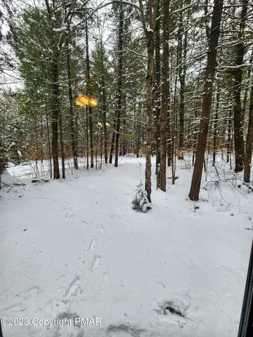 a brick building with a tree in front of it