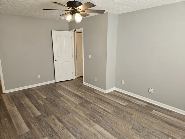 a view of a livingroom with a chandelier fan