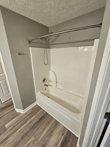 a bathroom with a double vanity sink and mirror