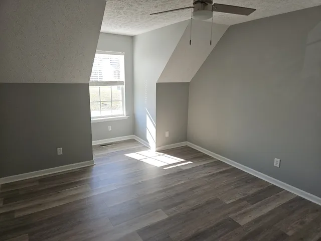 a view of a livingroom with wooden floor