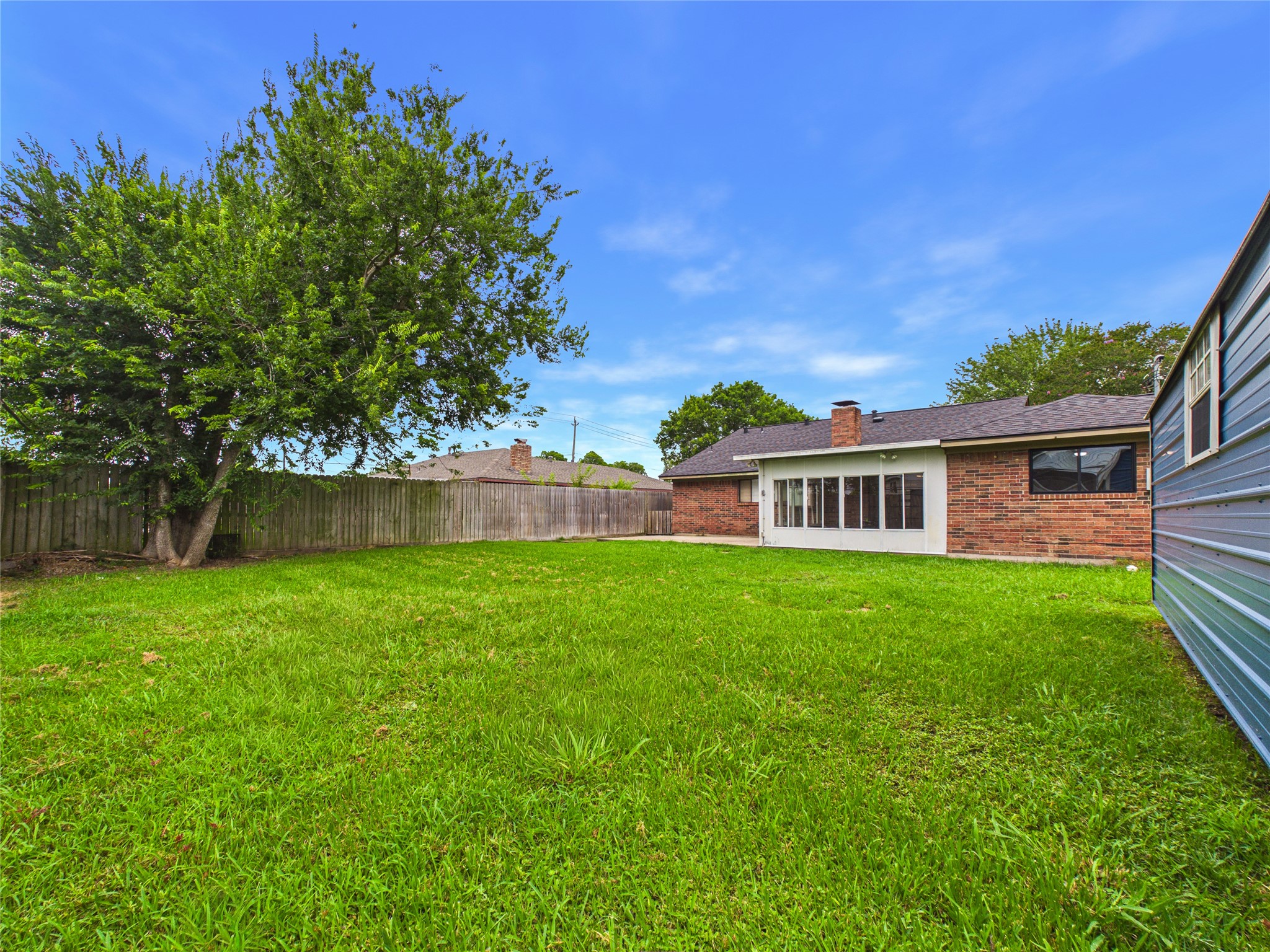 10306 Rustic Rock Road La Porte, TX 77571 - Photo 38 of 38 a view of a yard in front of a house with a large tree