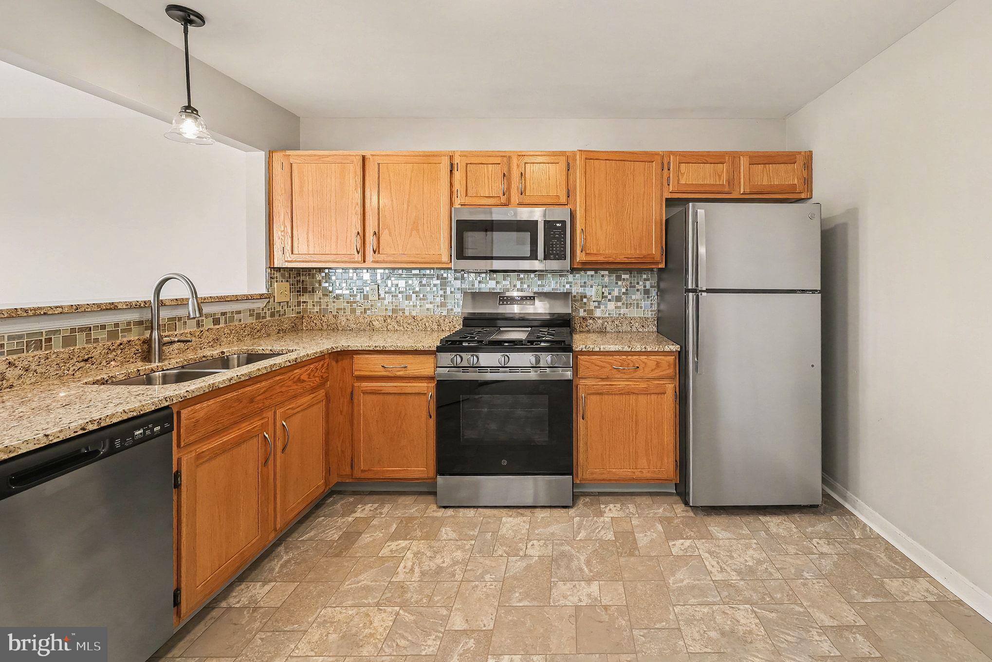 156 Sparrow Road Hummelstown, PA 17036 - Photo 16 of 29 a kitchen with a sink stove and refrigerator