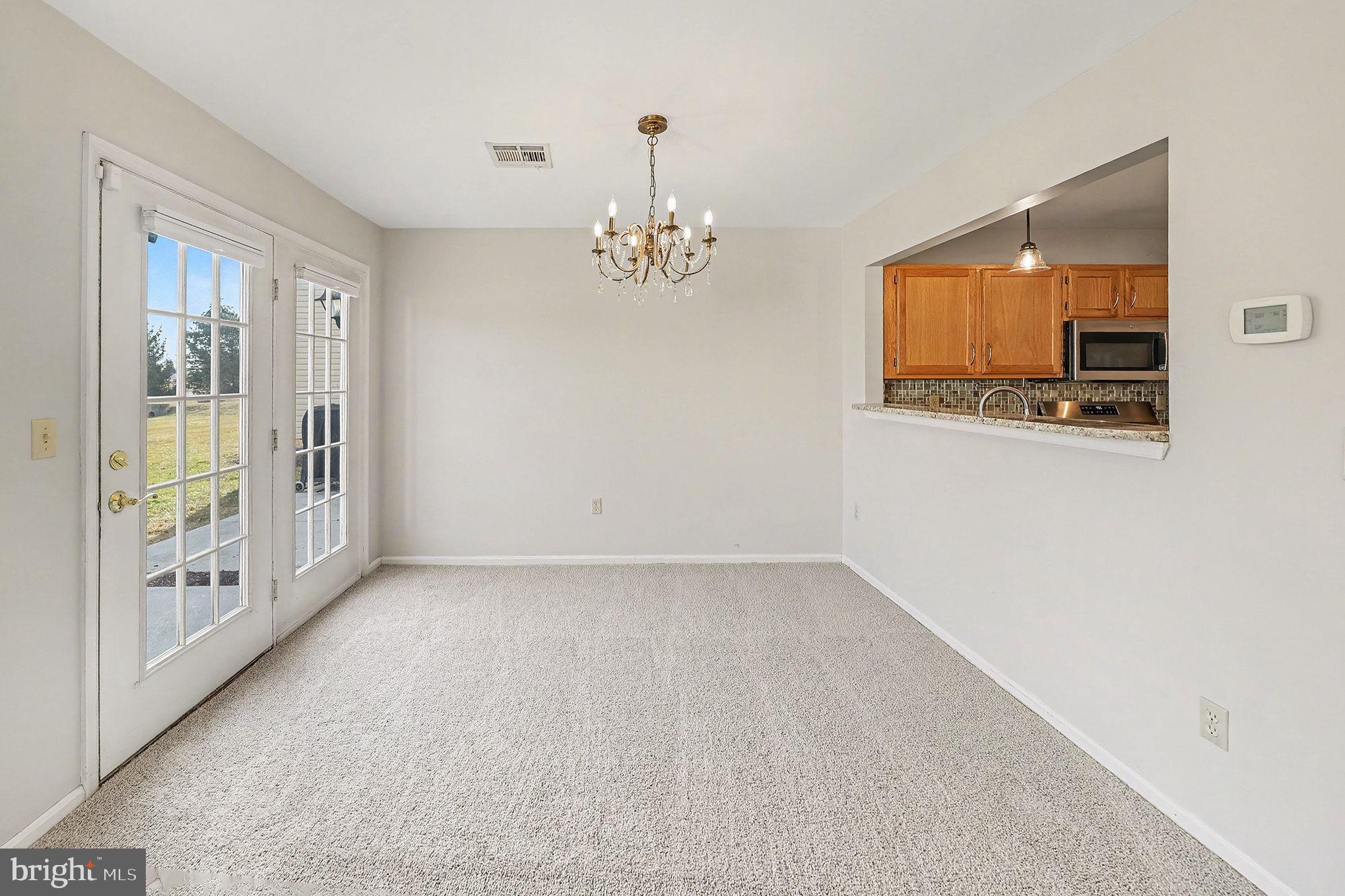156 Sparrow Road Hummelstown, PA 17036 - Photo 22 of 29 a view of a livingroom with a chandelier fan and windows