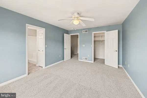 a view of an empty room with cabinet