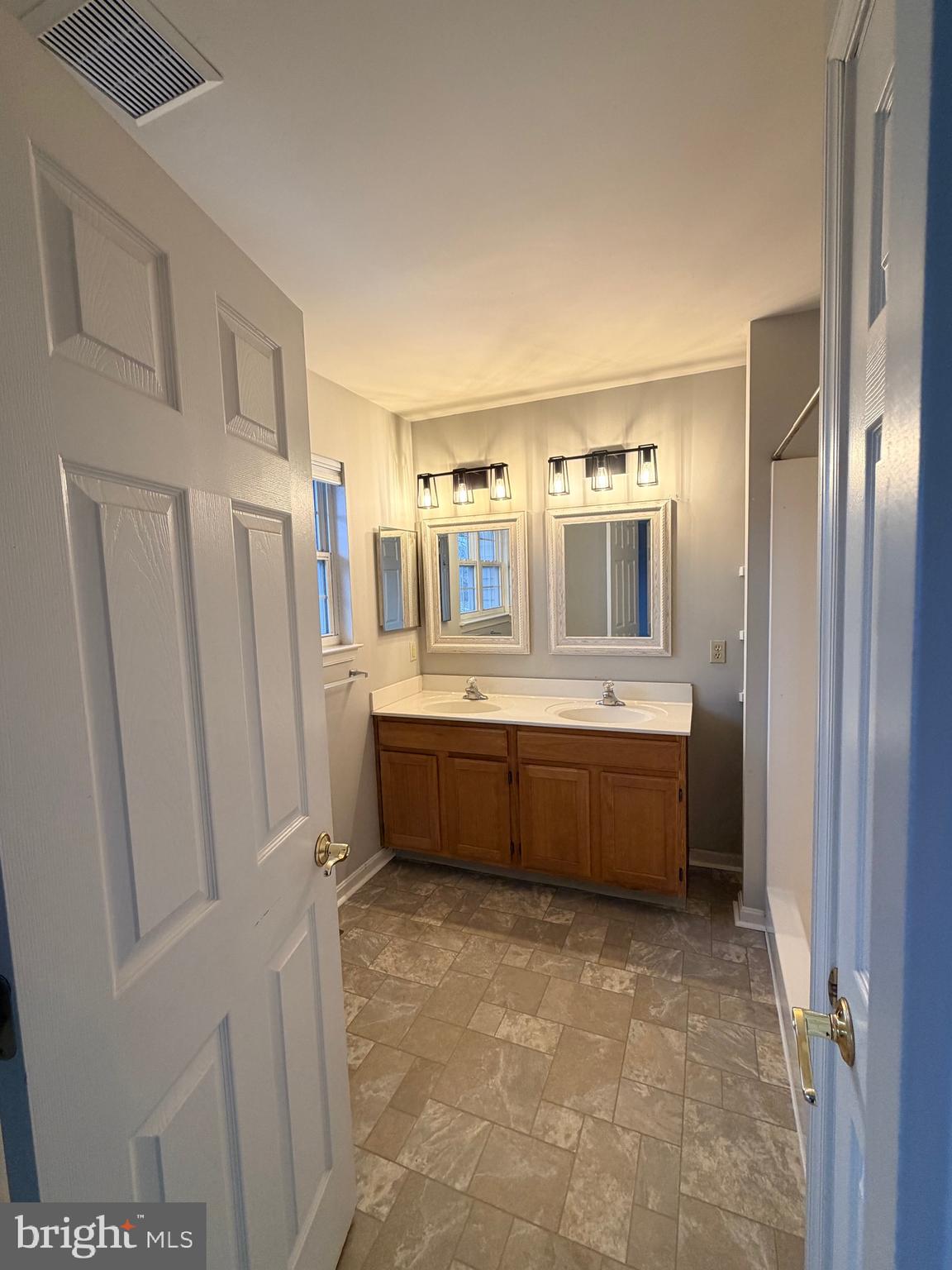 156 Sparrow Road Hummelstown, PA 17036 - Photo 10 of 29 a large bathroom with a double vanity sink and mirror