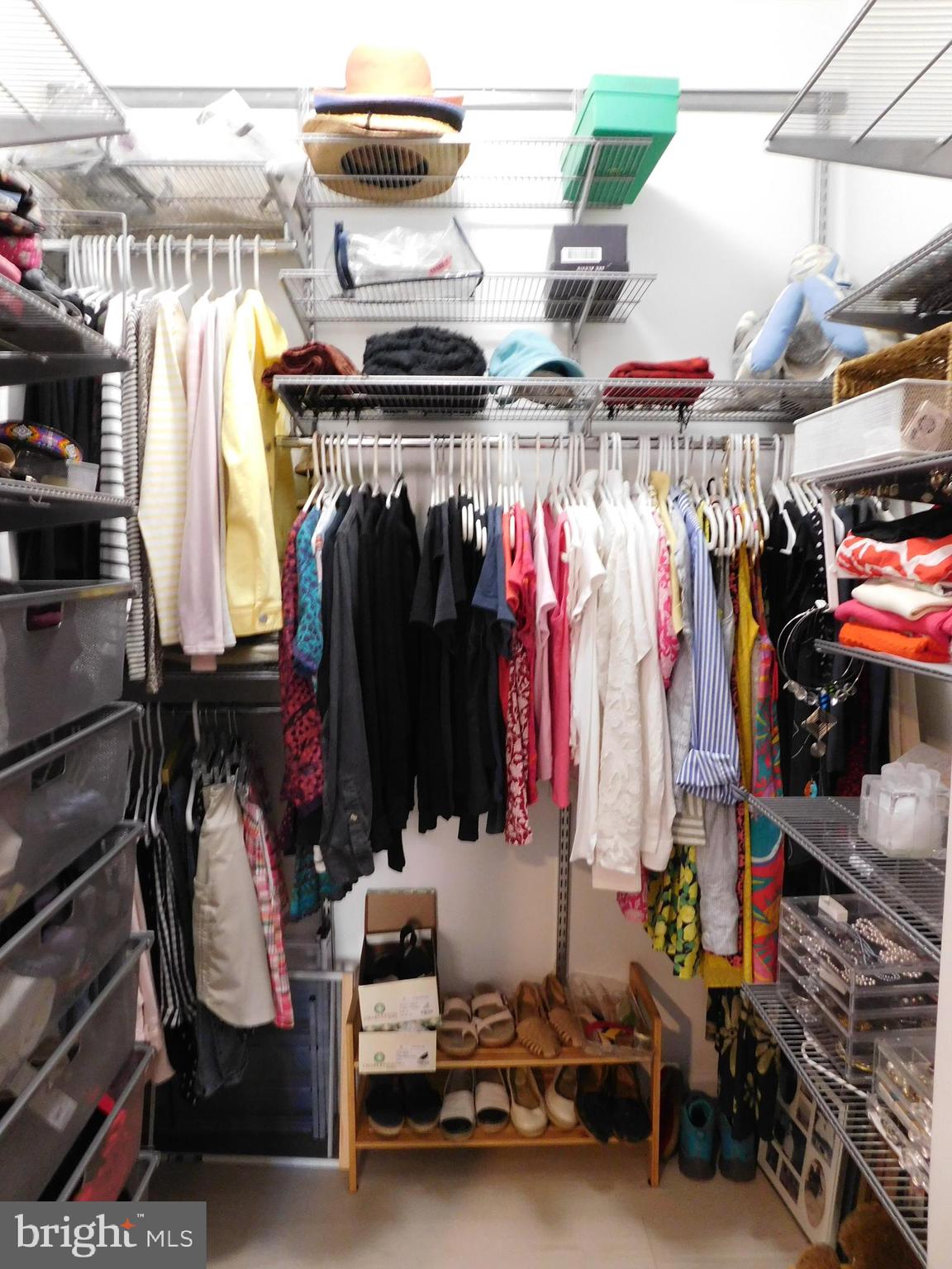 1855 Stratford Park Place, Unit 103 Reston, VA 20190 - Photo 23 of 49 Professionally organized closet in Primary Bedroom