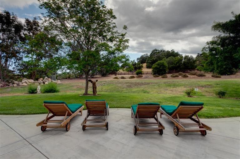 12751 Blue Heron Circle Ojai, CA 93023 - Photo 17 of 22 a view of a patio with a garden and chairs