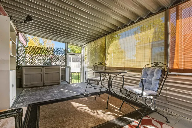 a room with table and chairs