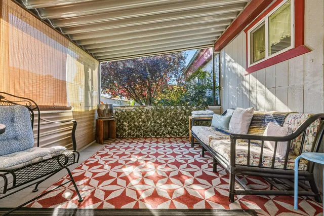 a view of a porch with furniture