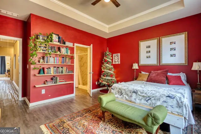 a bedroom with a bed and a bookshelf
