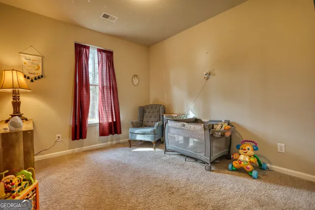 a room with furniture and a flat screen tv