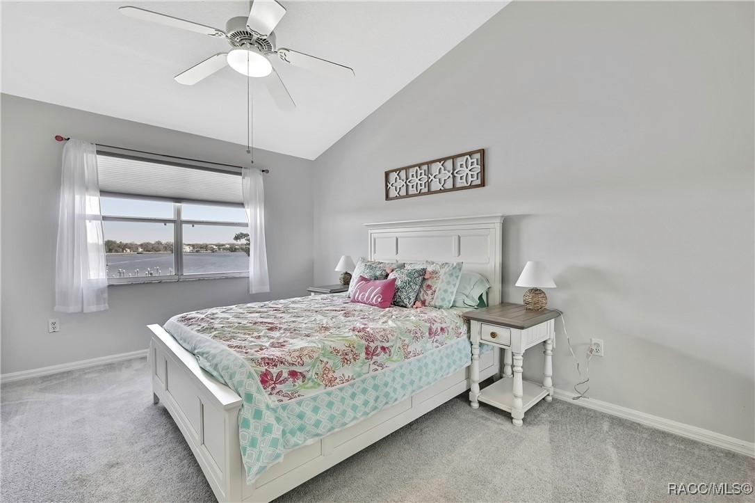 2855 North Rivers Edge Boulevard, Unit 213 Crystal River, FL 34429 - Photo 35 of 62 a bedroom with a bed and a dresser