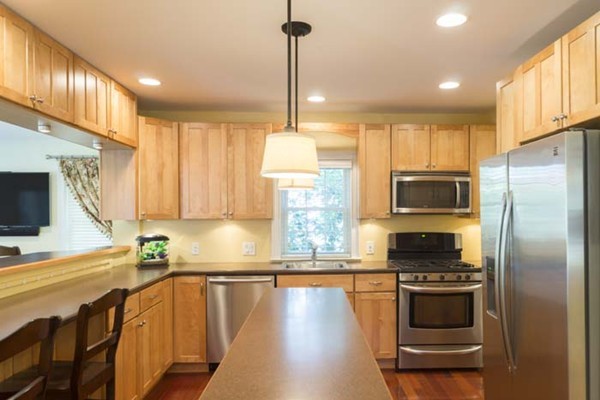 4 Prospect Road Andover, MA 01810 - Photo 5 of 30 a kitchen with stainless steel appliances a stove refrigerator sink and microwave