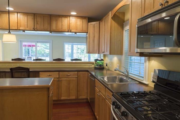 4 Prospect Road Andover, MA 01810 - Photo 9 of 30 a kitchen with a sink and a stove top oven
