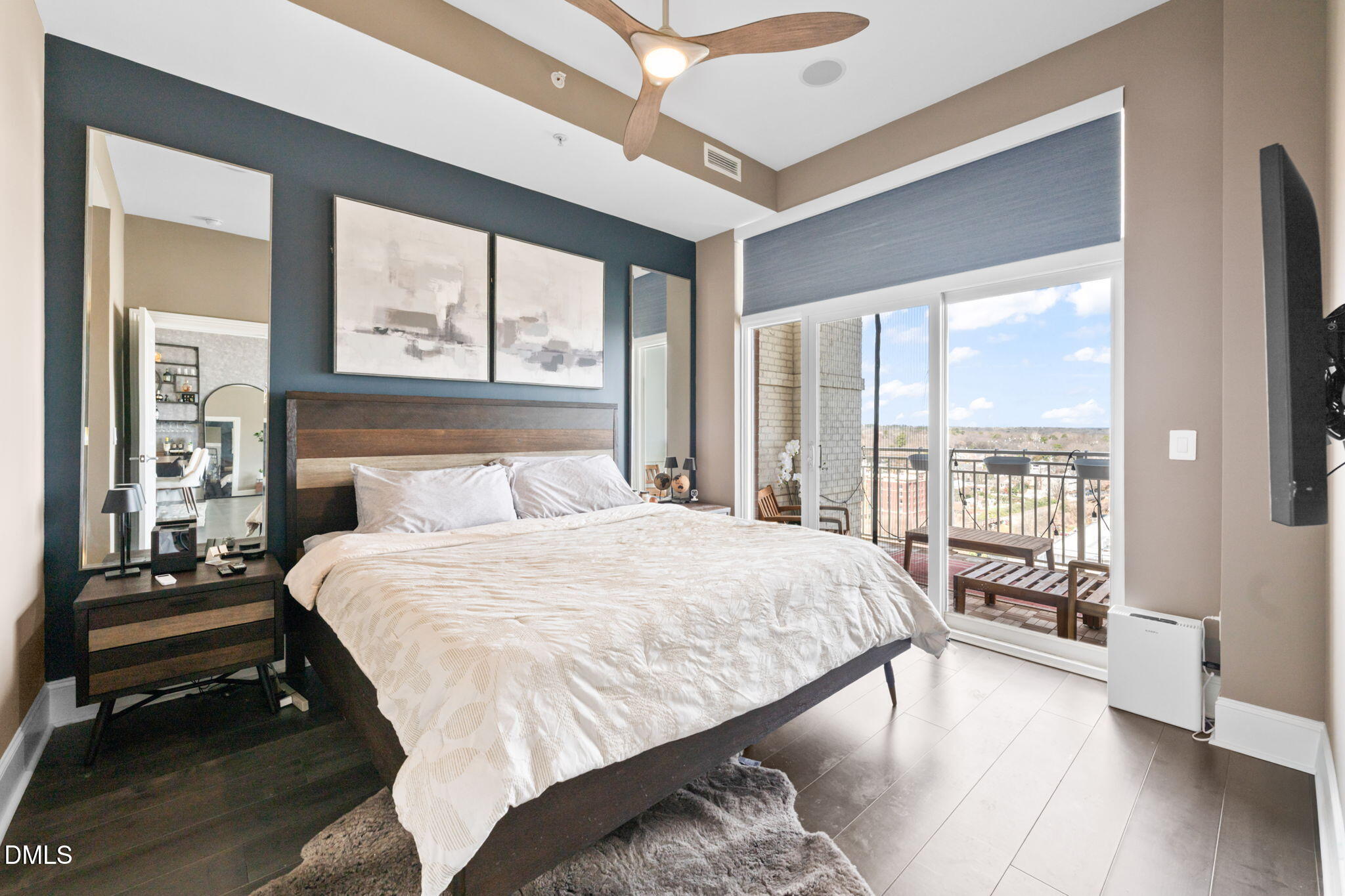 400 West North Street, Unit 1218 Raleigh, NC 27603 - Photo 16 of 41 a bedroom with a large bed and a large window with outer view