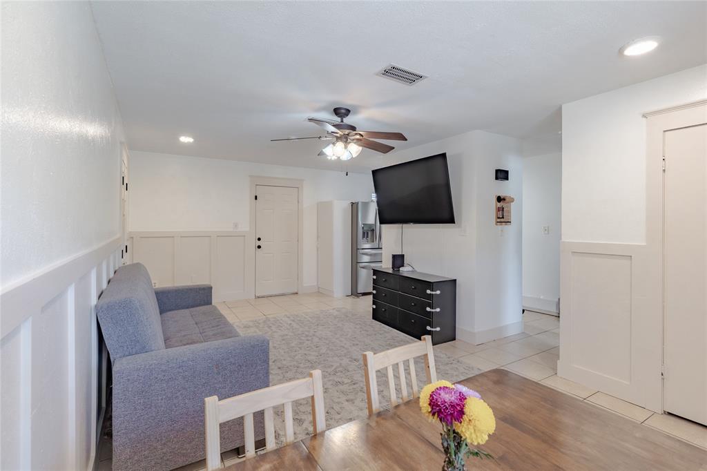 200 West Hale Avenue Decatur, TX 76234 - Photo 3 of 14 a living room with furniture and a flat screen tv