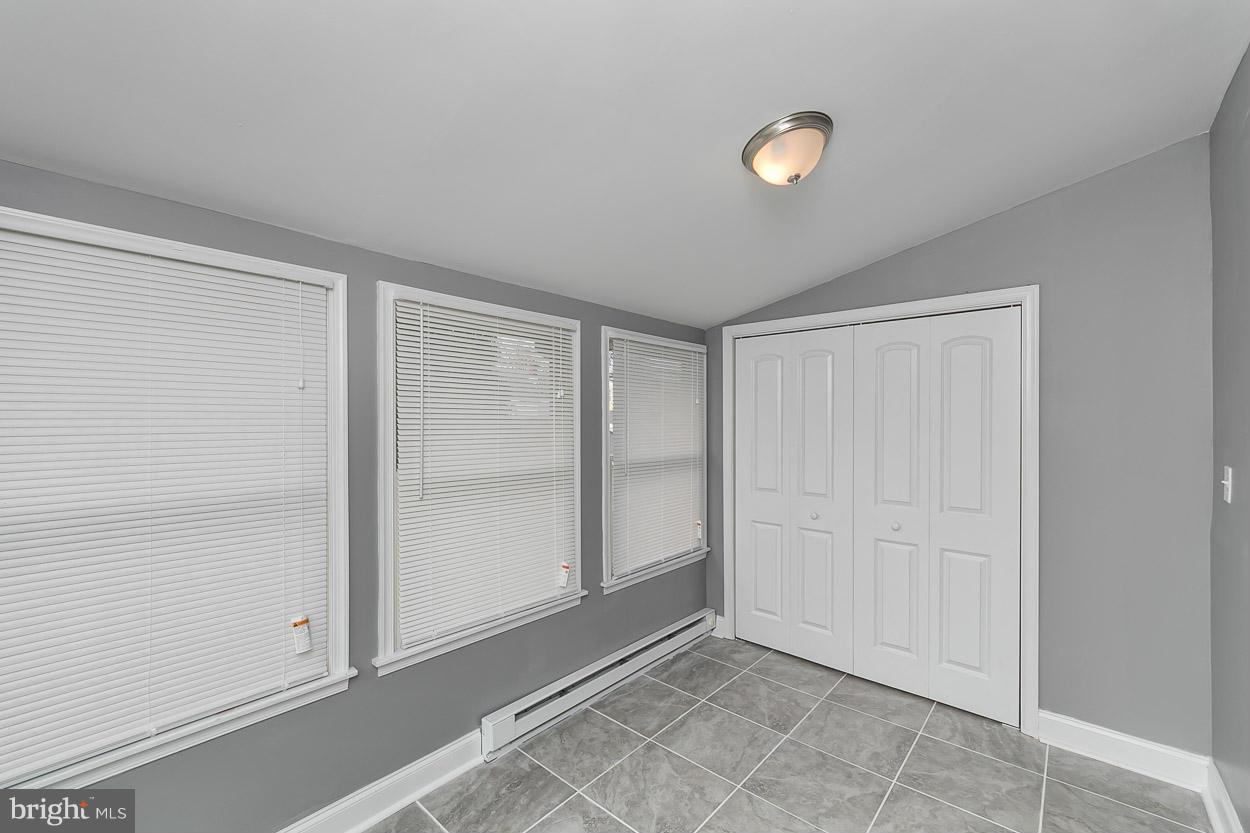 8221 Longpoint Road Baltimore, MD 21222 - Photo 13 of 24 a view of an empty room and window