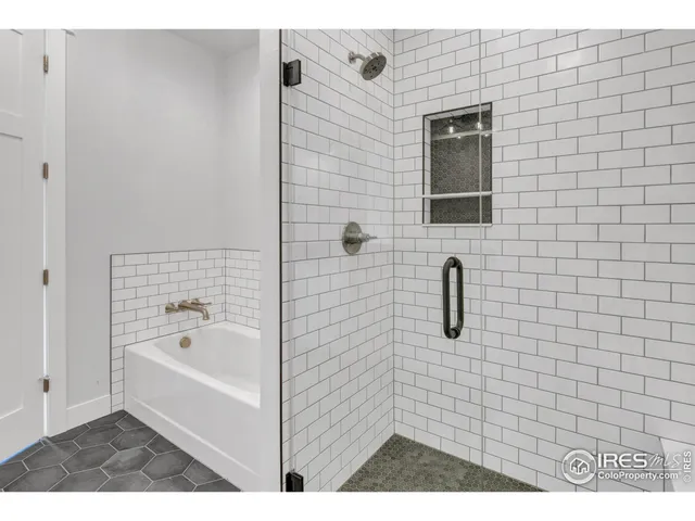 a view of walk in closet and empty room