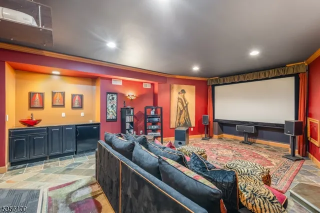a kitchen with stainless steel appliances kitchen island granite countertop a sink and cabinets