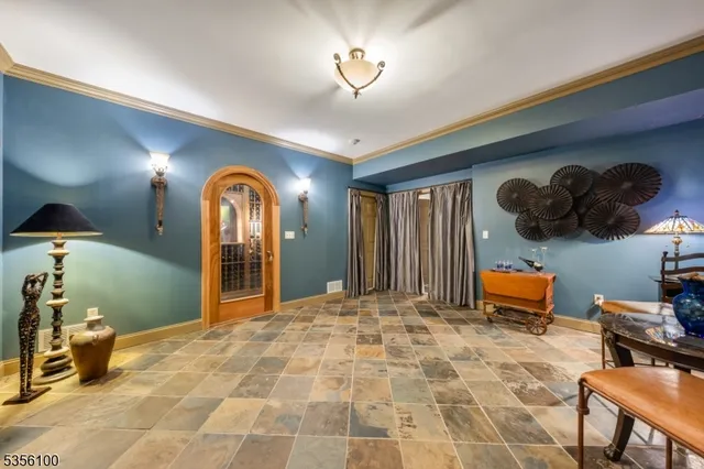 a bedroom with furniture and a large mirror