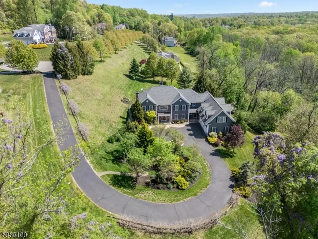 a view of a house with a swimming pool and a yard